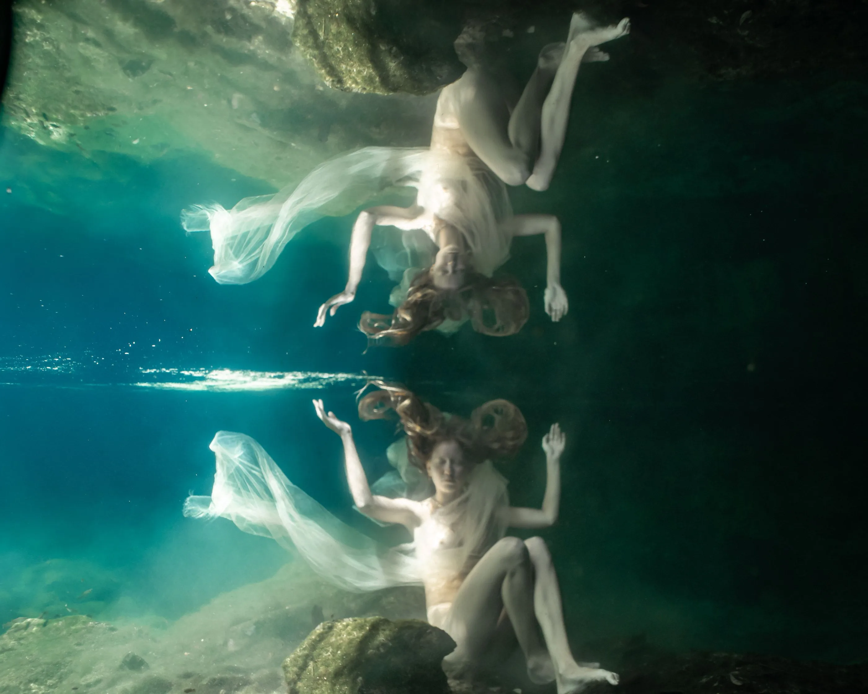 Swimmer drifting in open blue water
